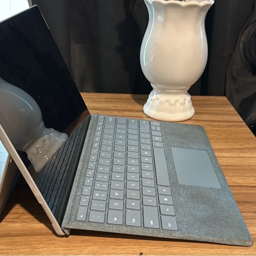Sleek Silver Laptop with Accessories